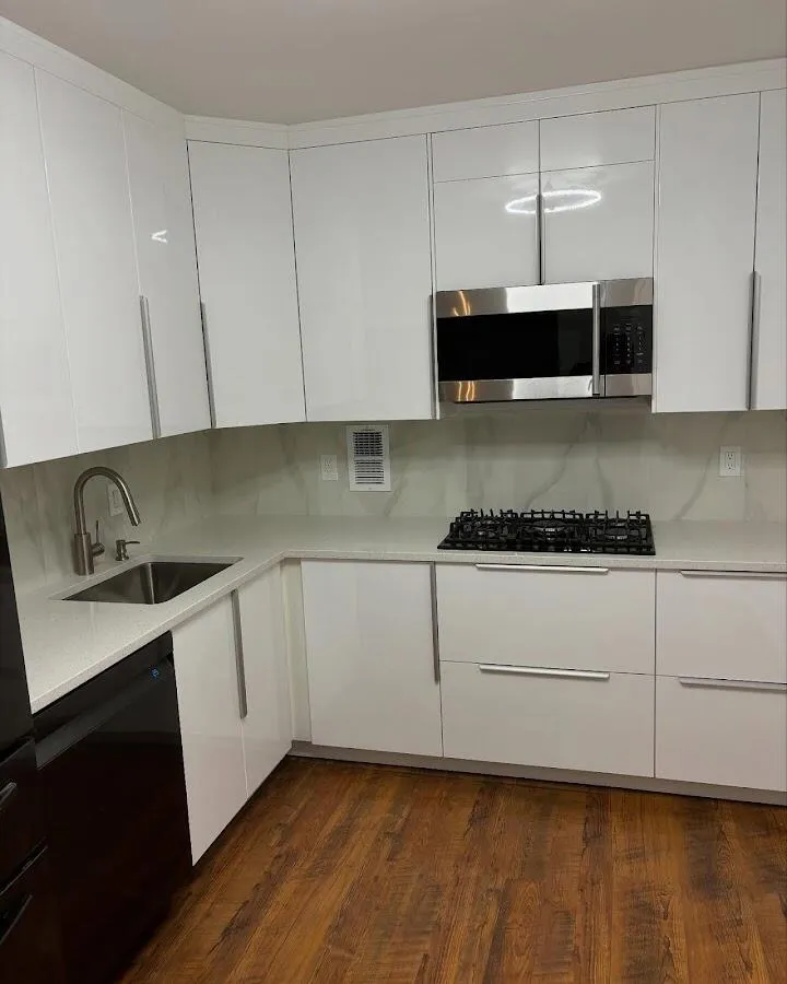 Restored kitchen with white cabinets after water damage in District Heights
